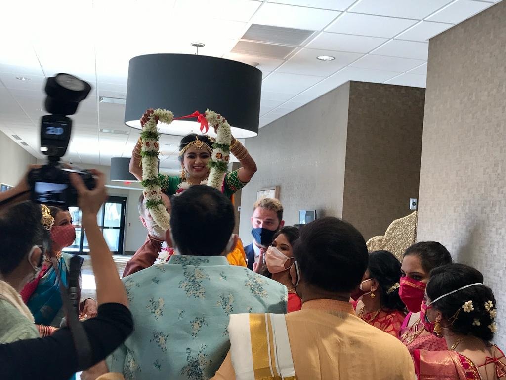 Garland exchange during an interfaith wedding
